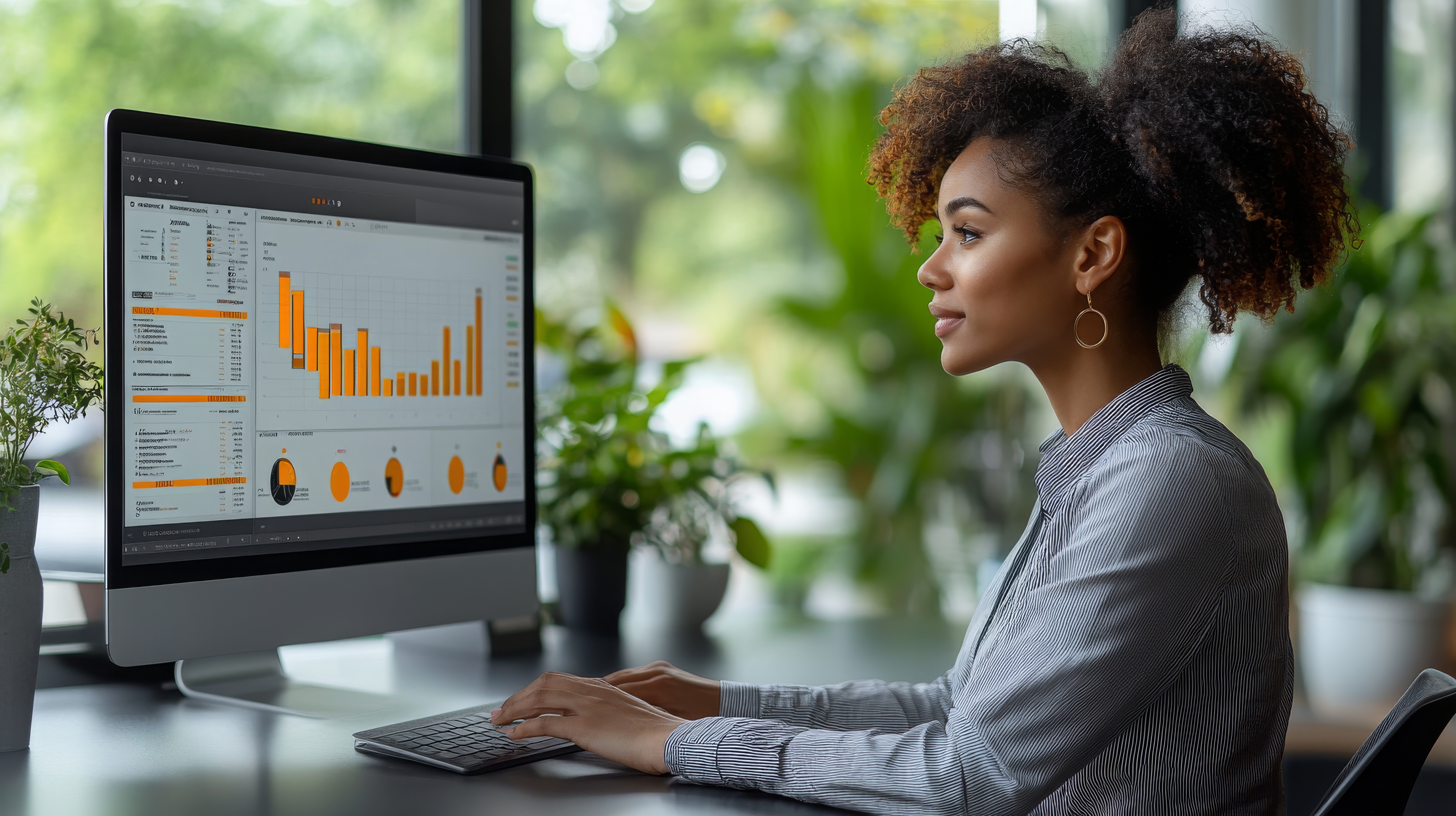 woman at desk looking at CDP analytics 