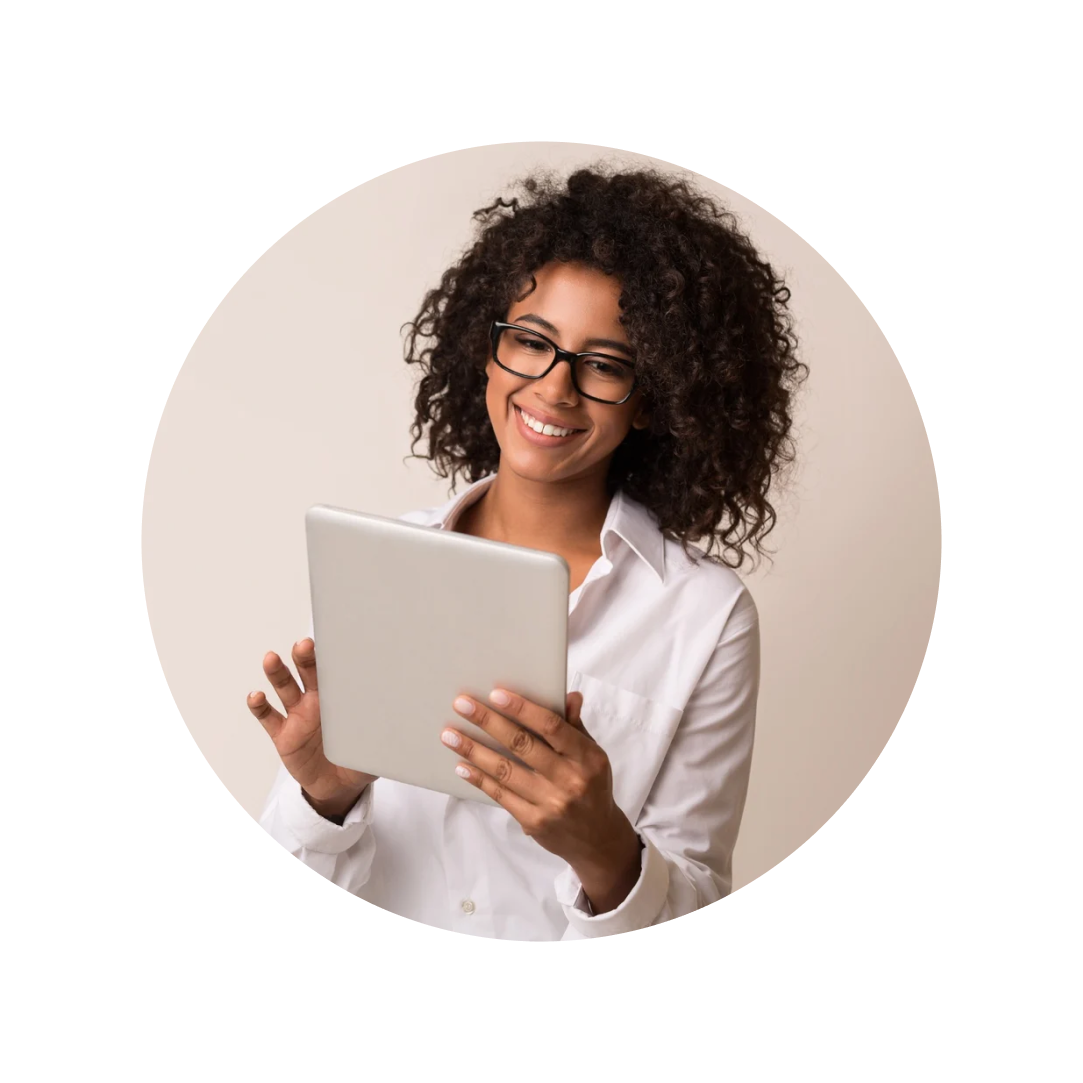 woman smiling while using tablet