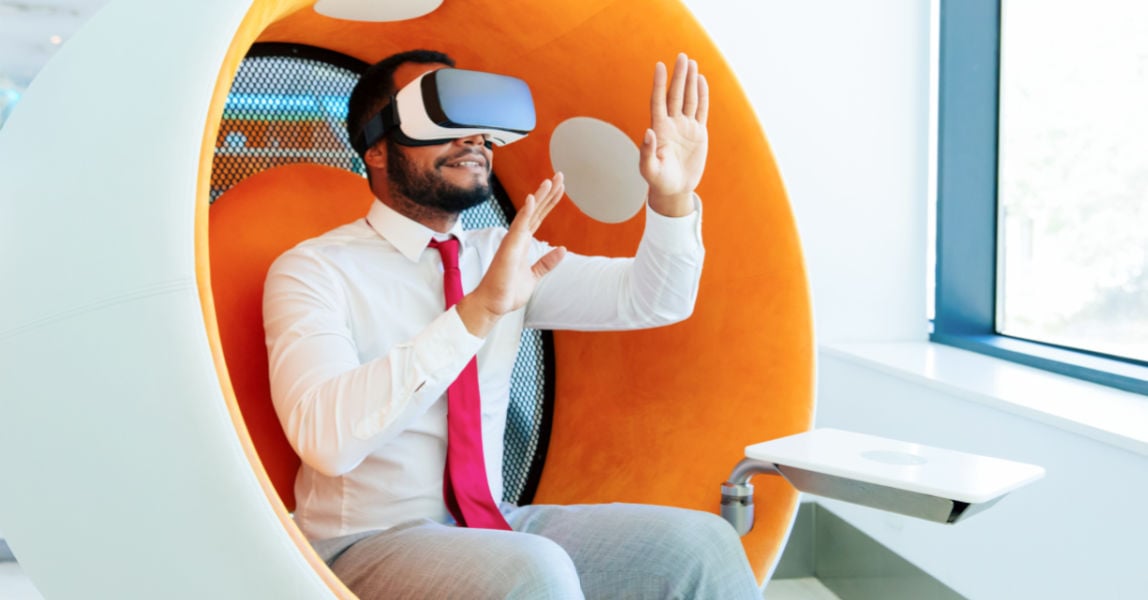 Man with virtual reality glasses in pod