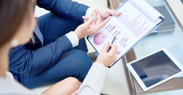 Man woman reviewing financial report