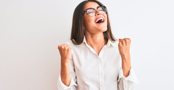 excited woman in white shirt